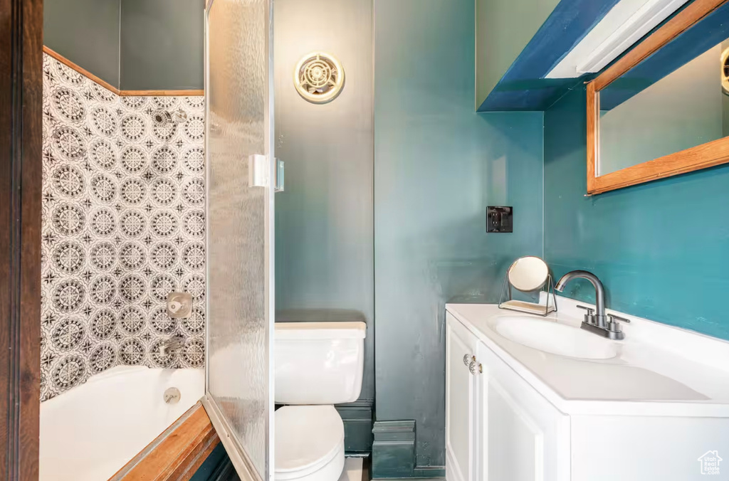 Full bathroom featuring vanity, shower / bathing tub combination, and toilet