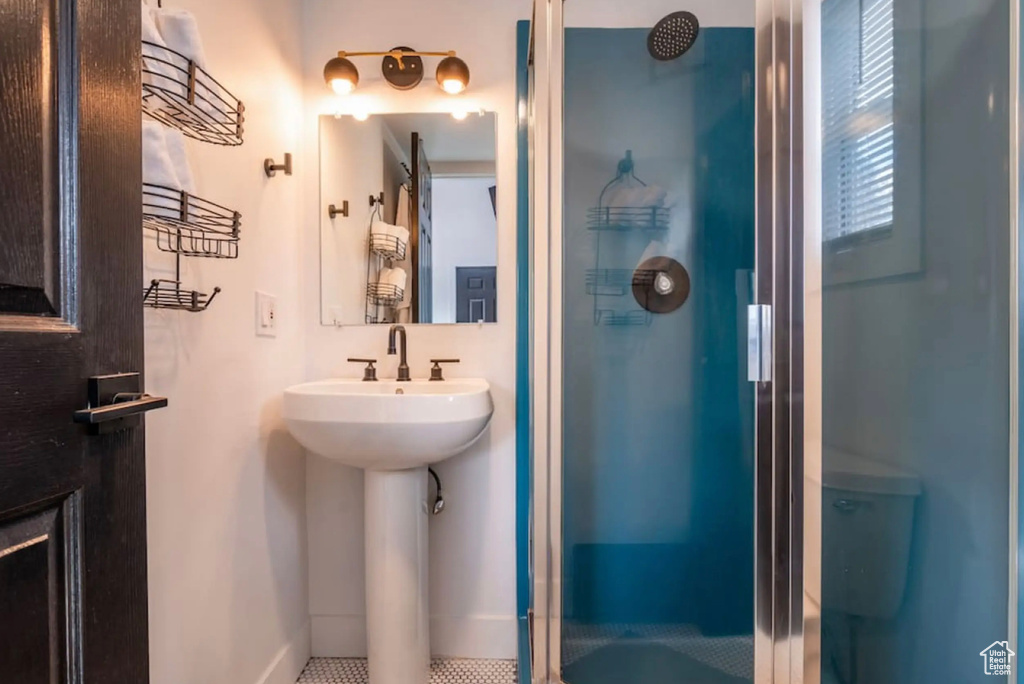 Bathroom with tile patterned floors and walk in shower