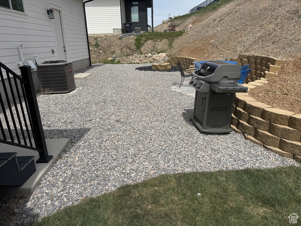 View of patio / terrace with grilling area and central air condition unit