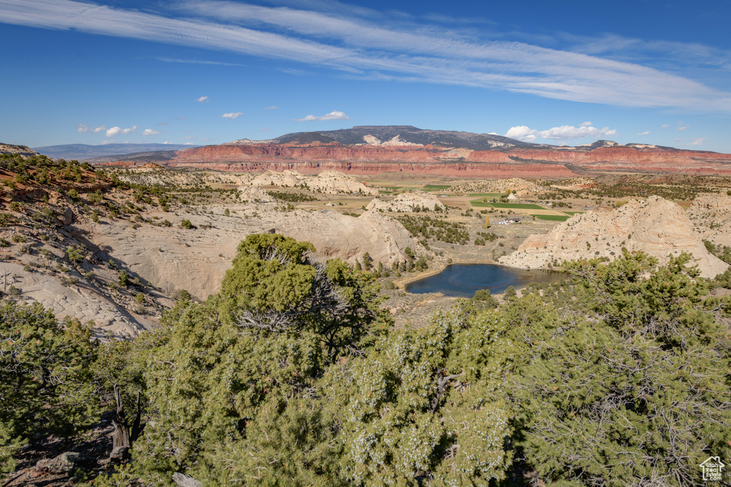 Property view of mountains featuring a water view