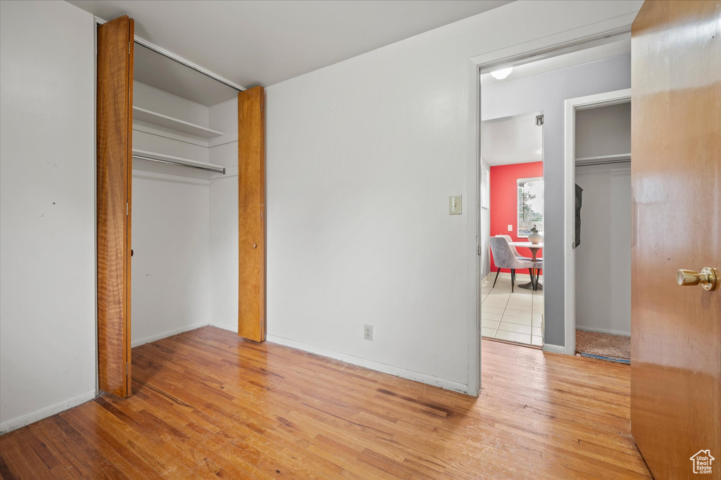 Unfurnished bedroom with light hardwood / wood-style floors