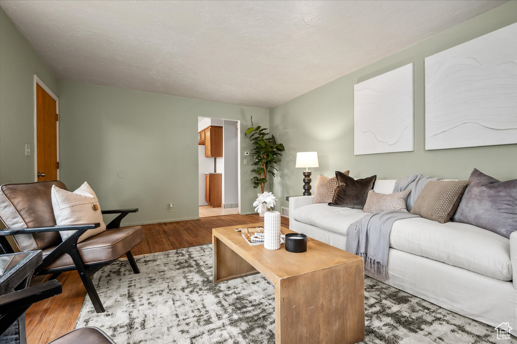 Living room with hardwood / wood-style floors