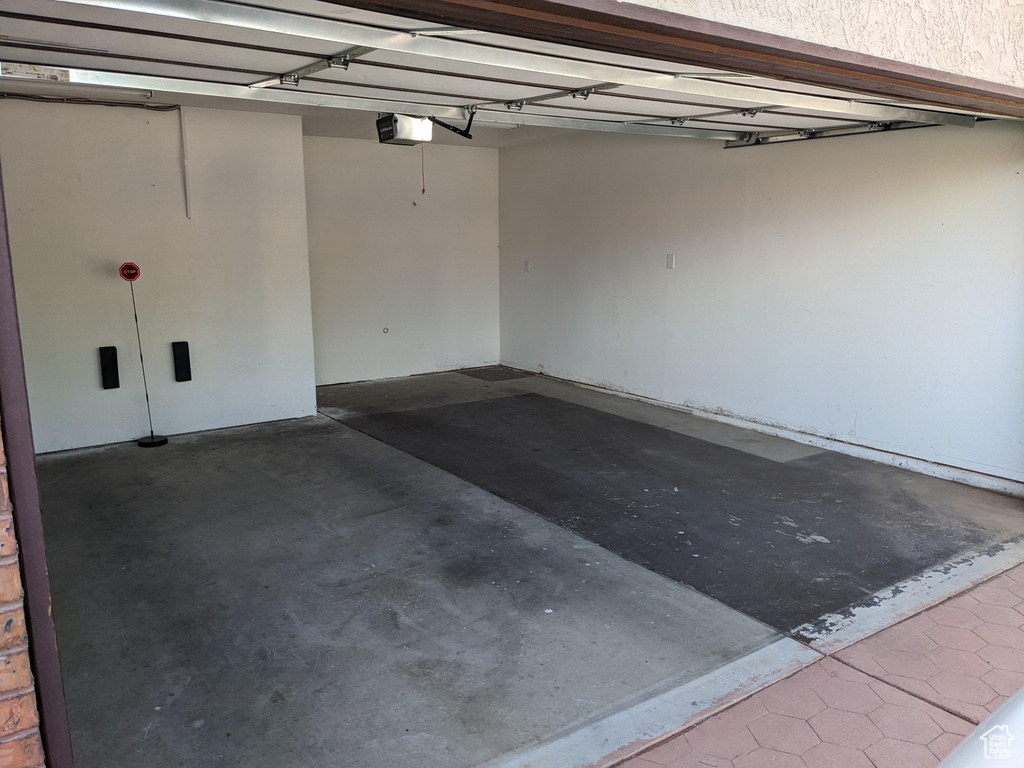 Garage featuring a garage door opener