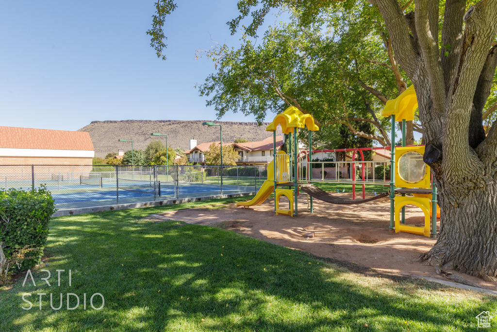 View of play area featuring a yard