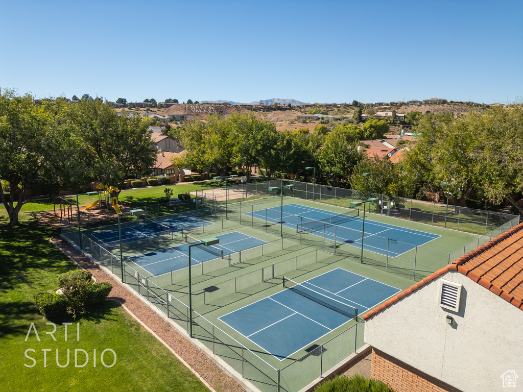 View of sport court featuring a playground