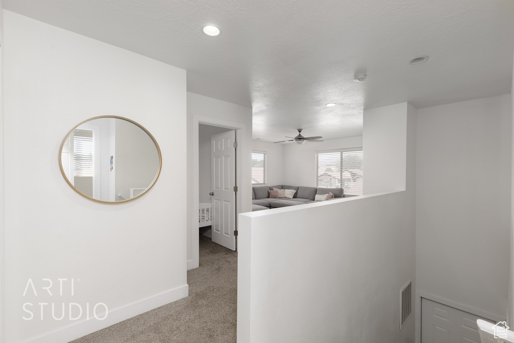 Hall with light colored carpet