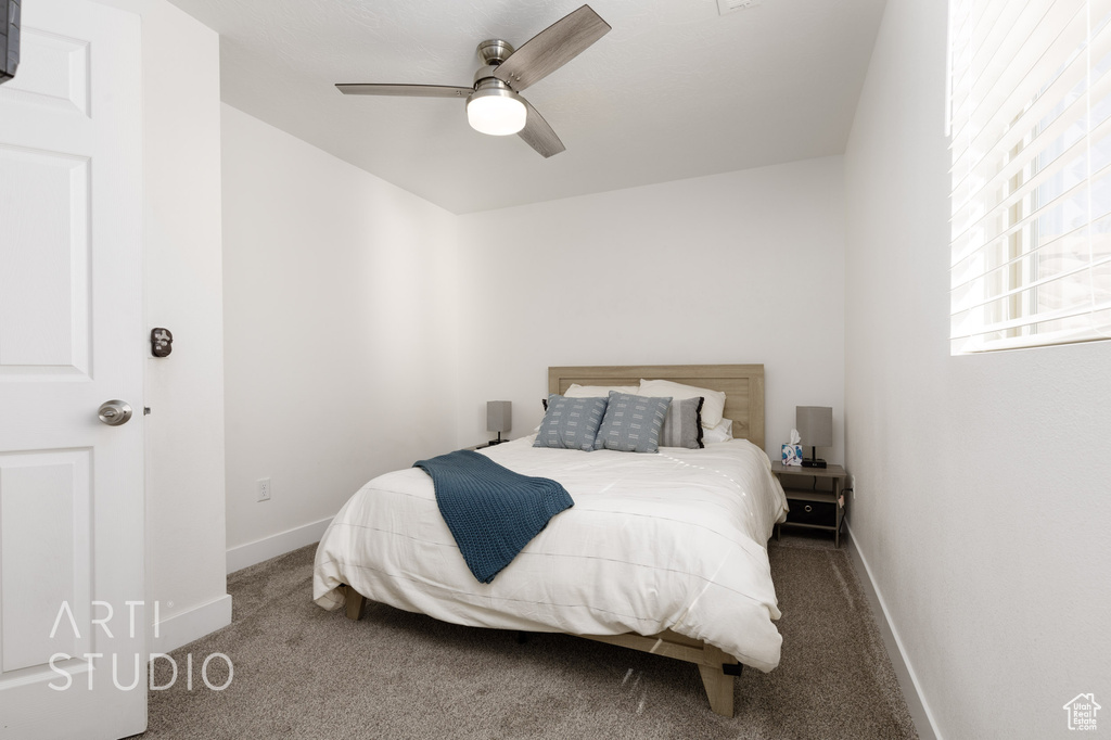 Bedroom featuring carpet and ceiling fan
