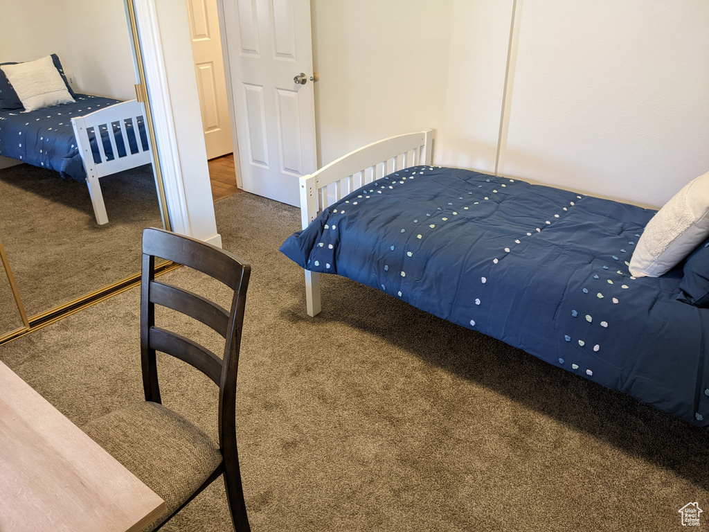 Bedroom featuring a closet and carpet