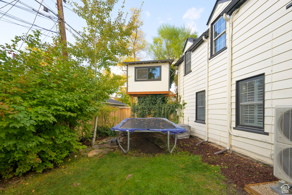 View of yard featuring a trampoline