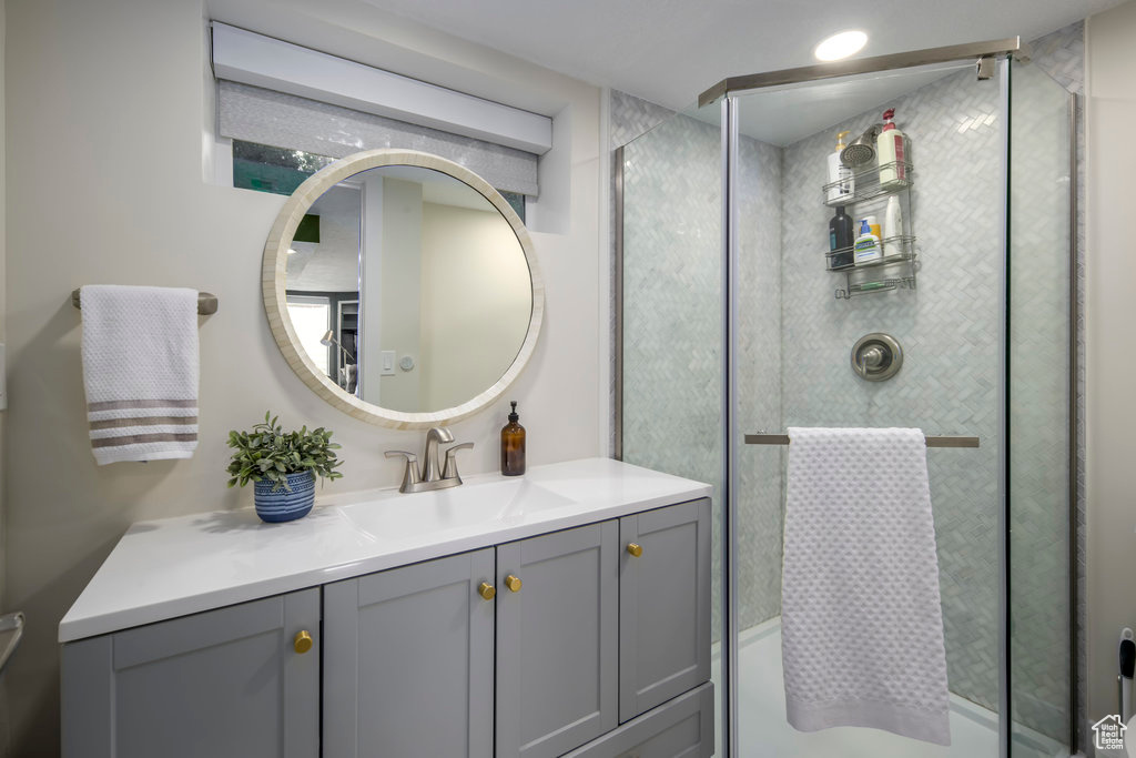 Bathroom with vanity and an enclosed shower