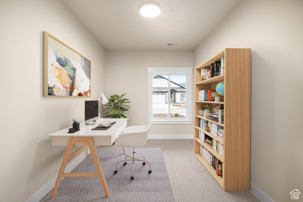 Office featuring baseboards and carpet