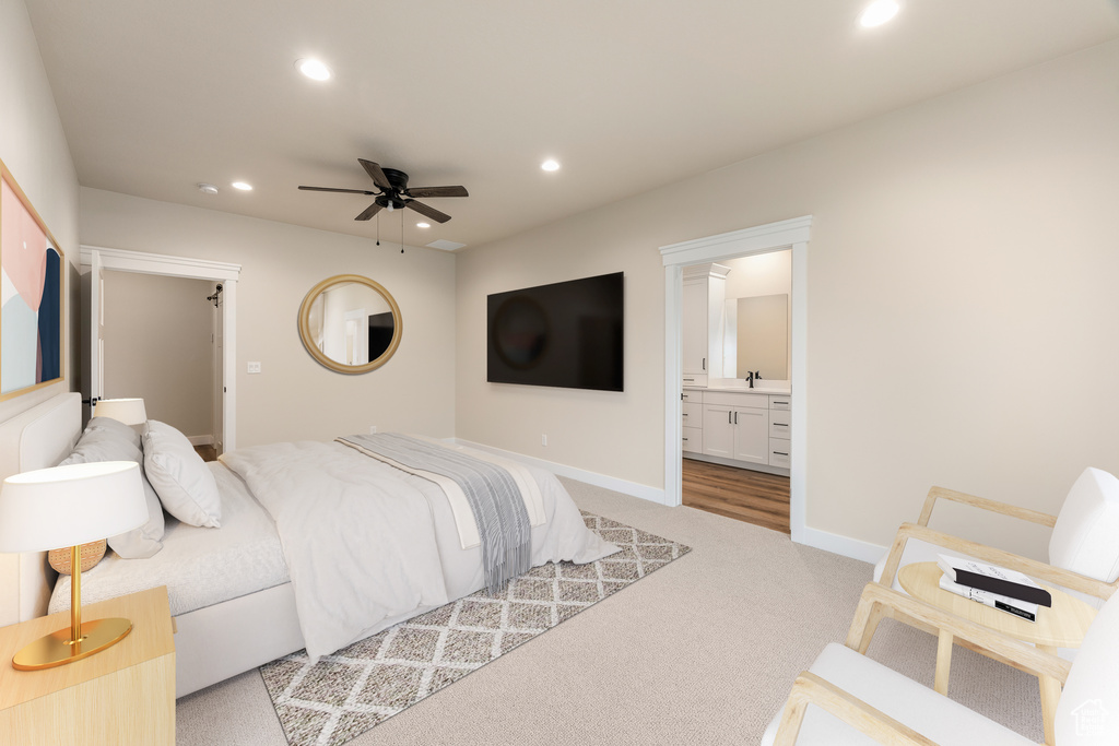 Bedroom featuring recessed lighting, light carpet, baseboards, a sink, and connected bathroom