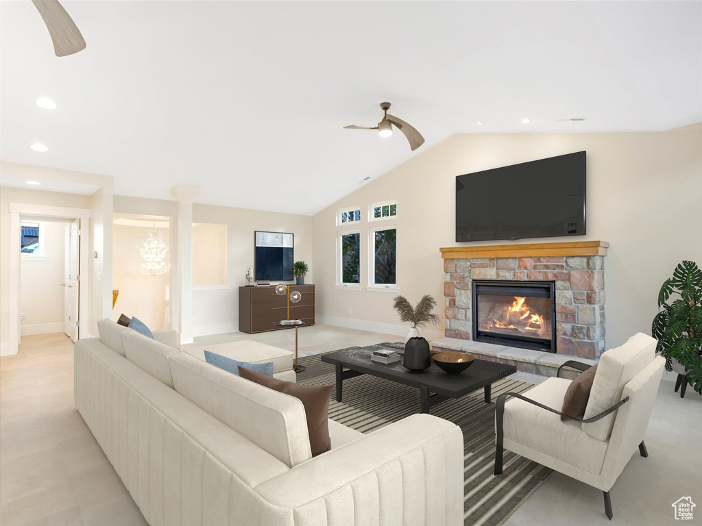 Living area with a fireplace, recessed lighting, vaulted ceiling, ceiling fan, and baseboards