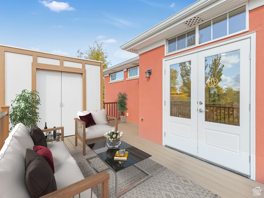 Exterior space featuring an outdoor hangout area, french doors, and a deck