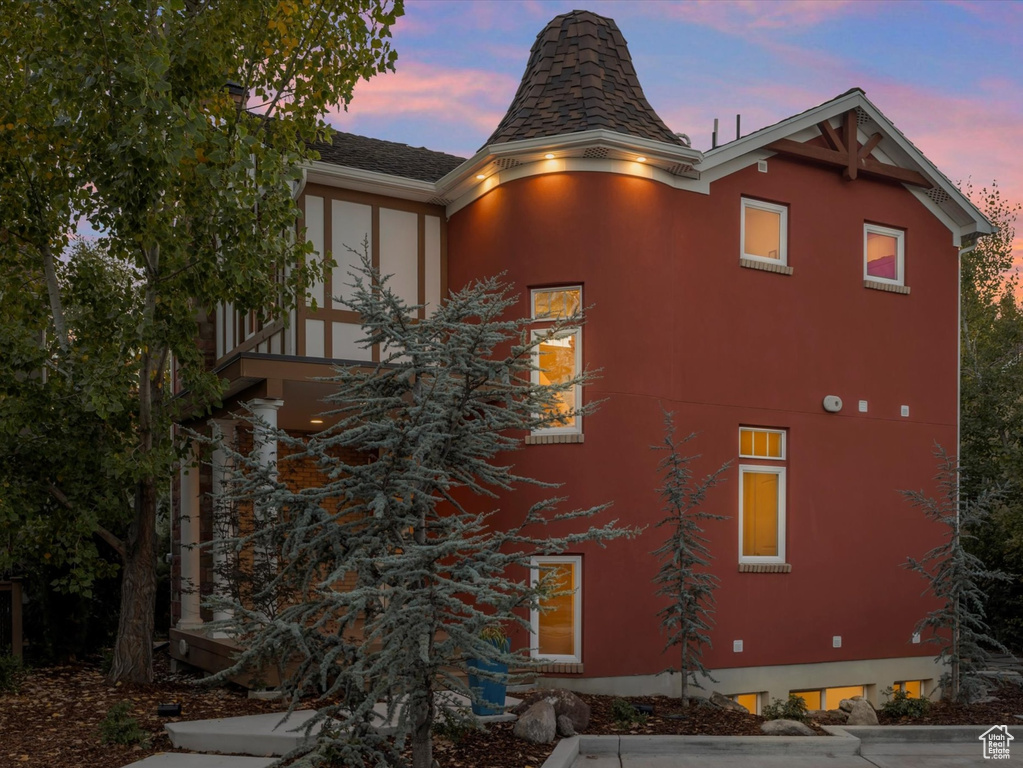 View of property exterior at dusk