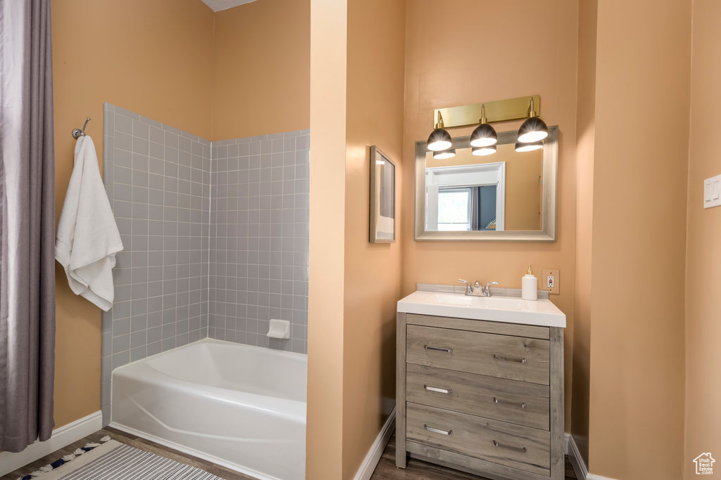 Bathroom featuring vanity and a bath