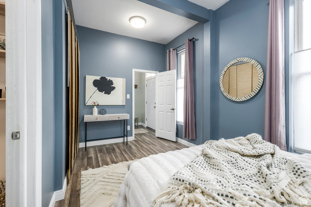 Bedroom with hardwood / wood-style floors