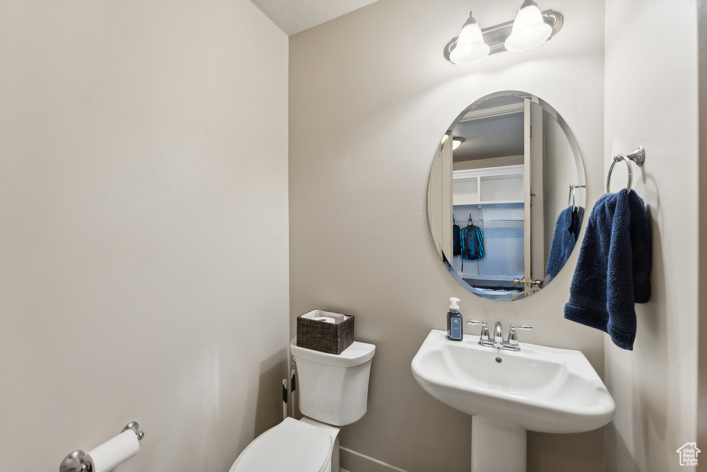 Bathroom with sink and toilet