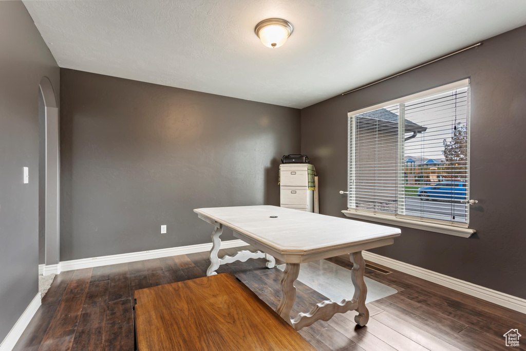 Office area featuring dark hardwood / wood-style floors