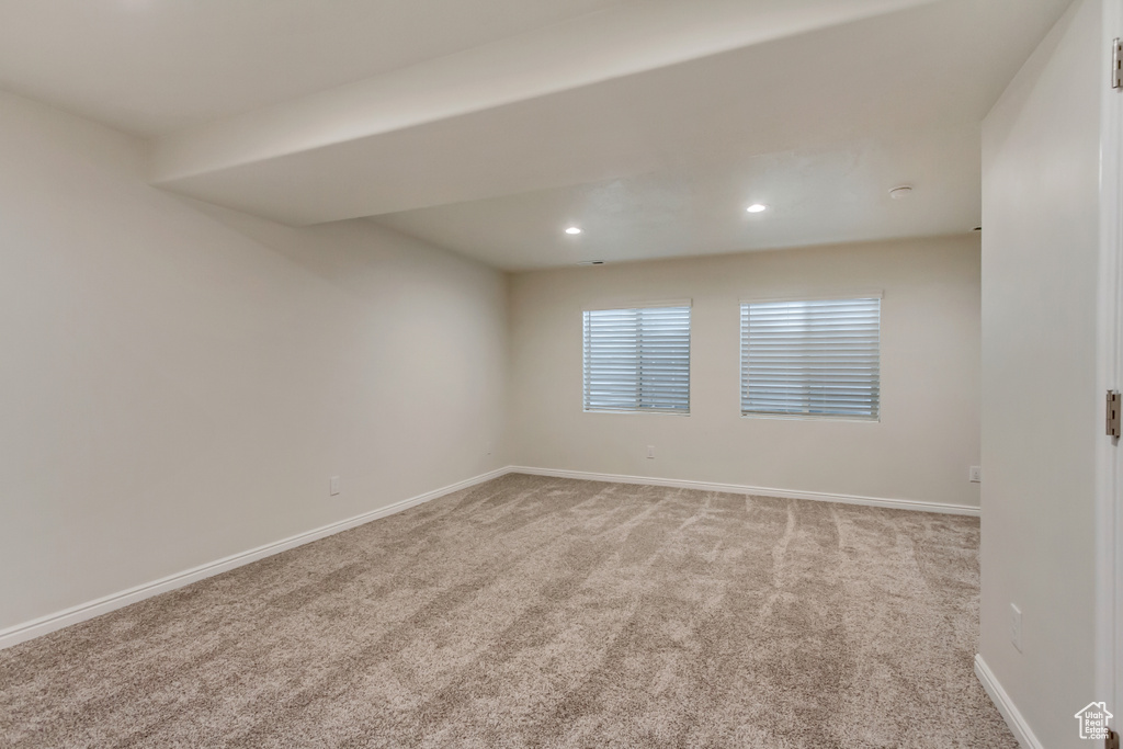 Unfurnished room with light colored carpet