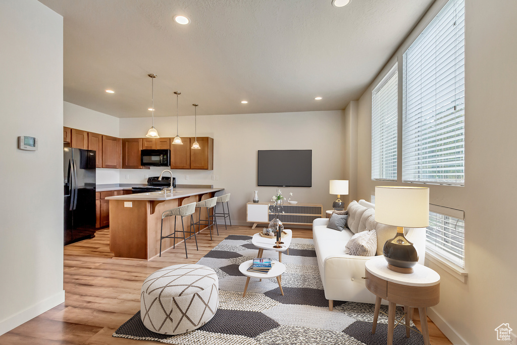 Living room with light wood-type flooring