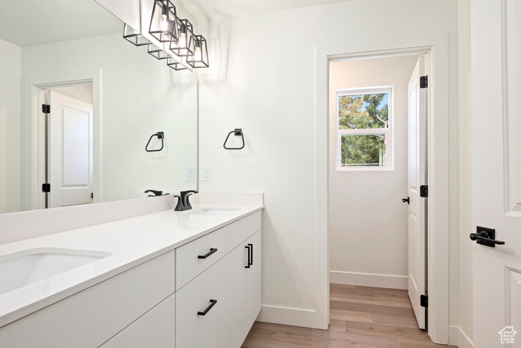 Bathroom featuring vanity and hardwood / wood-style flooring