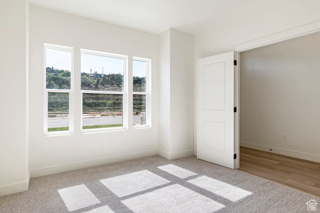 Unfurnished room featuring light hardwood / wood-style flooring