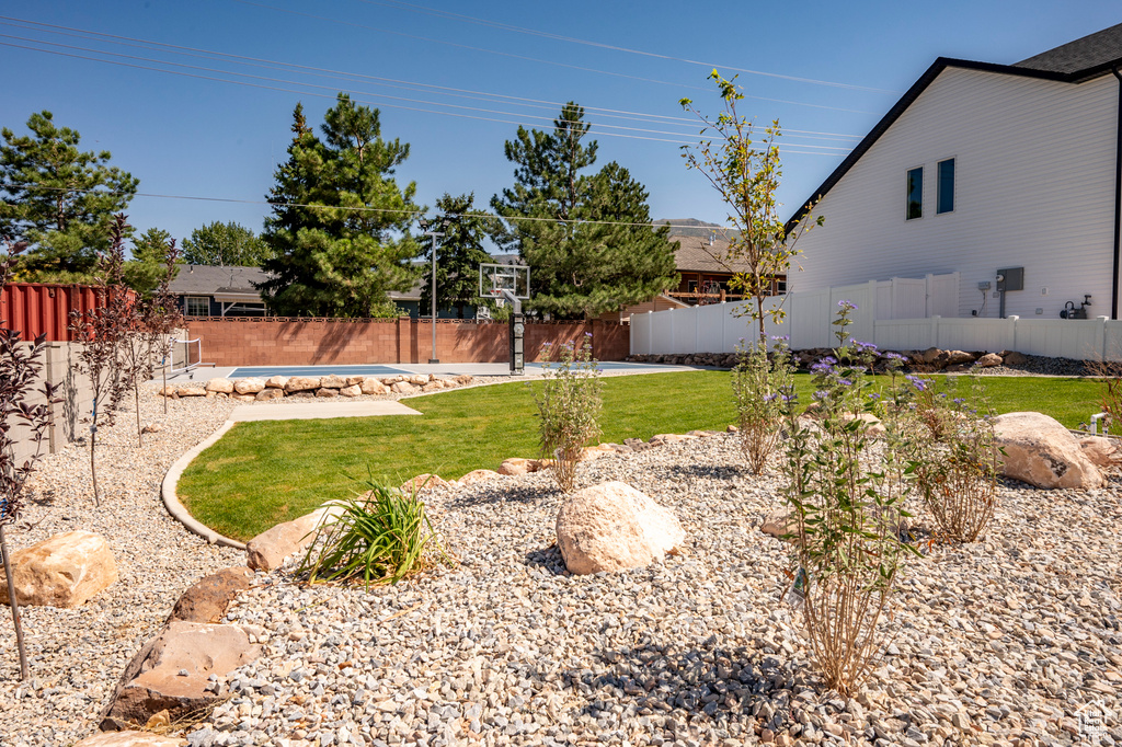 View of yard featuring a covered pool