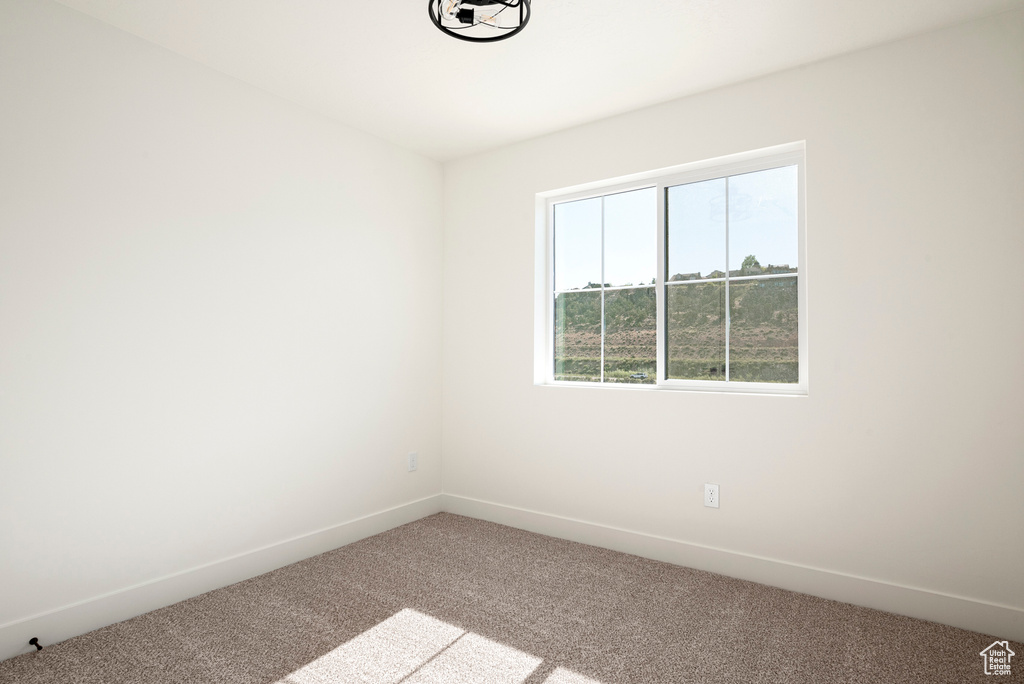 View of carpeted spare room