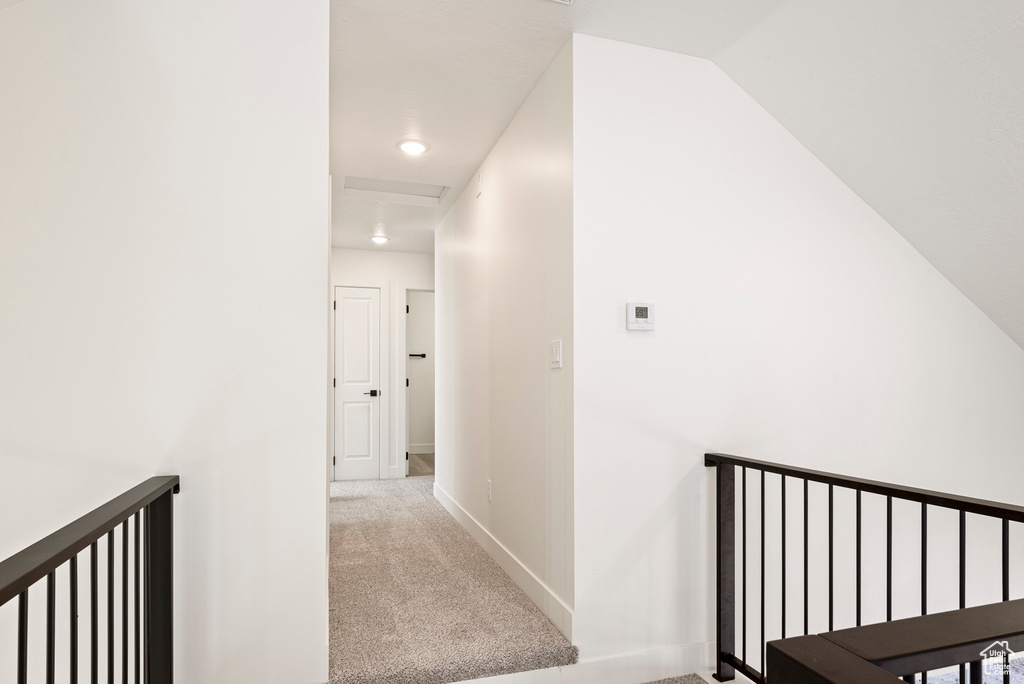 Hallway with light colored carpet