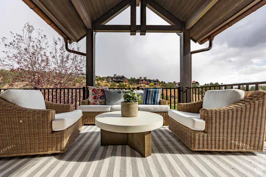 Wooden deck featuring an outdoor hangout area