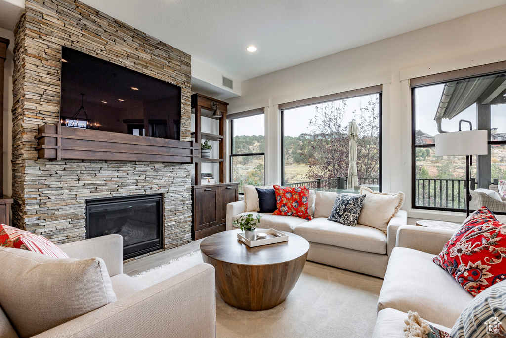 Living room with a stone fireplace