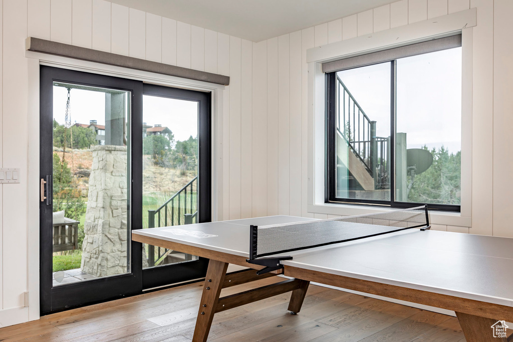 Interior space featuring light hardwood / wood-style floors and wooden walls