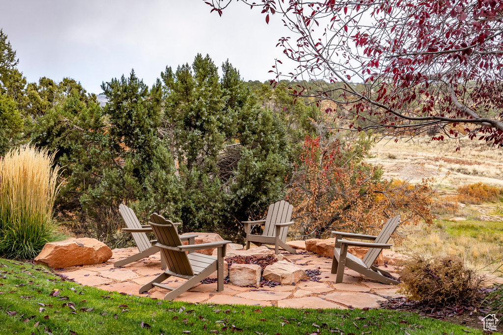 View of patio / terrace with an outdoor fire pit