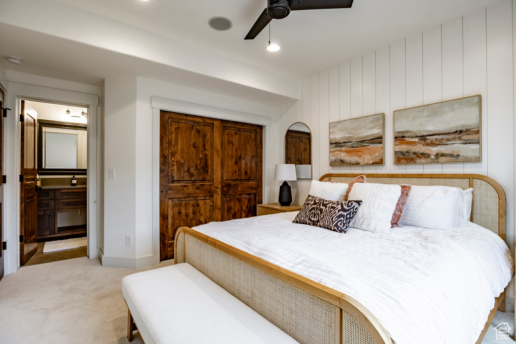 Carpeted bedroom with ceiling fan