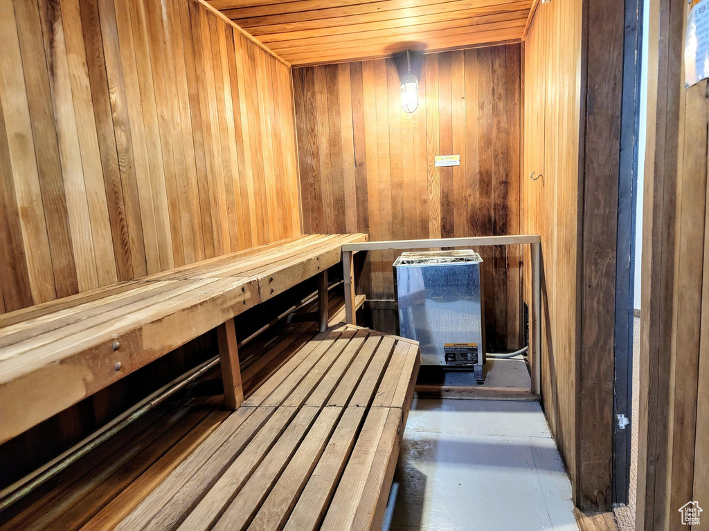 View of sauna / steam room featuring wooden walls and wood ceiling