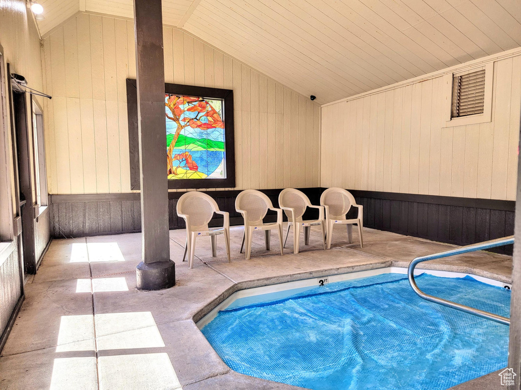 View of swimming pool featuring a hot tub