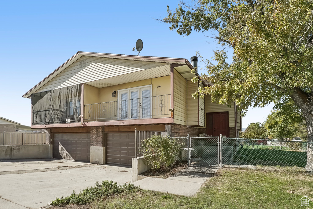 View of front of property with a garage