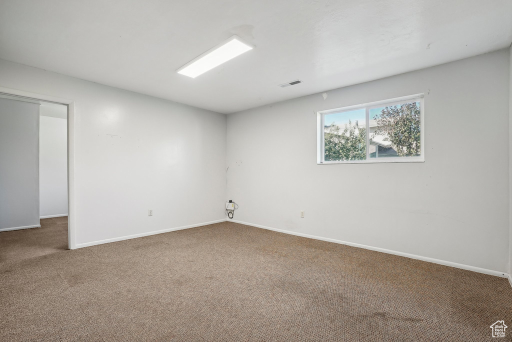 Spare room featuring carpet floors