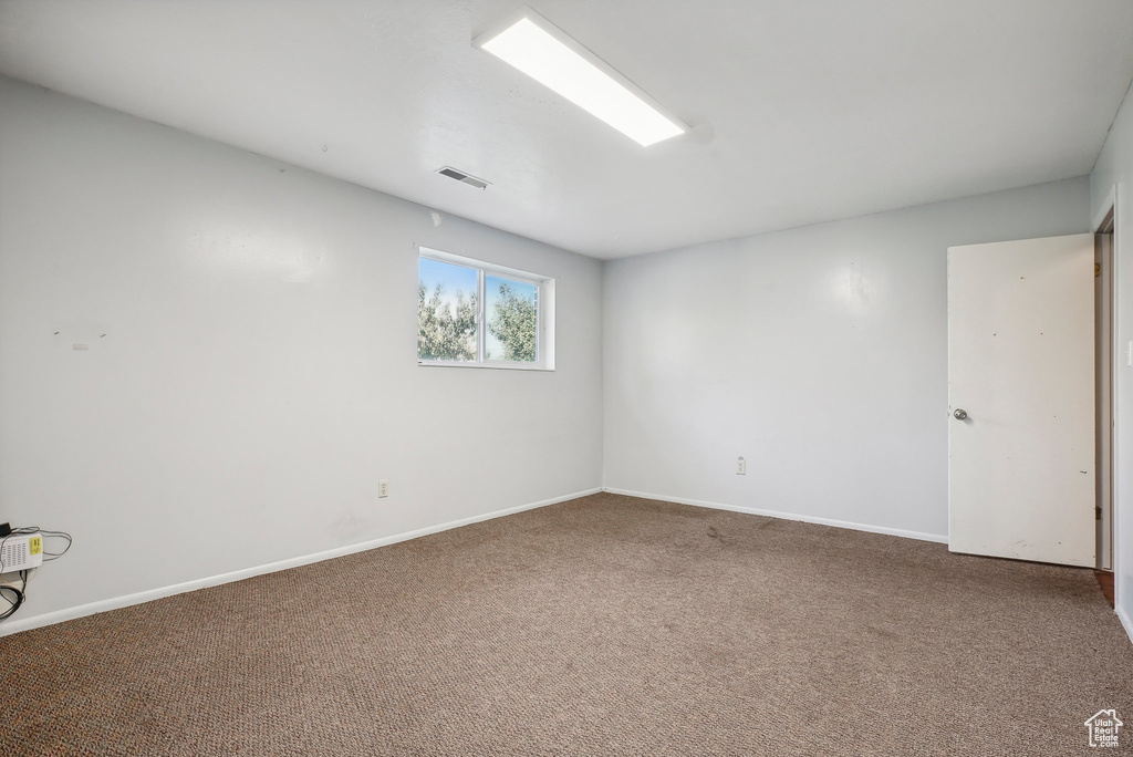 Spare room featuring carpet floors