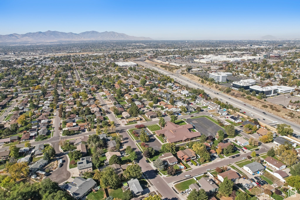 Birds eye view of property with a mountain view