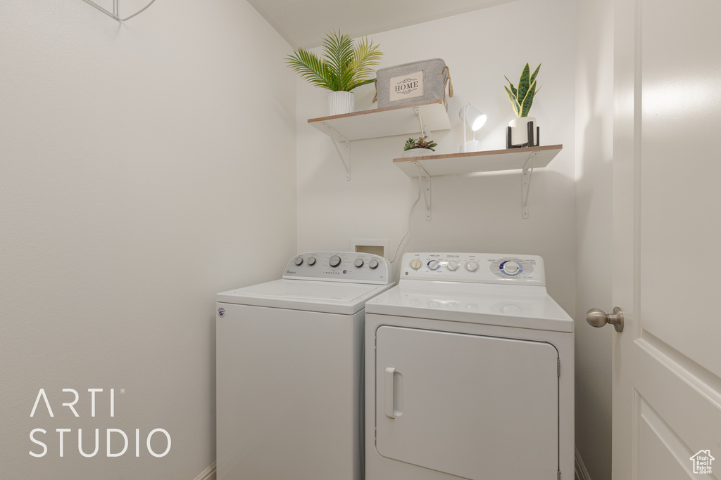 Laundry room featuring independent washer and dryer