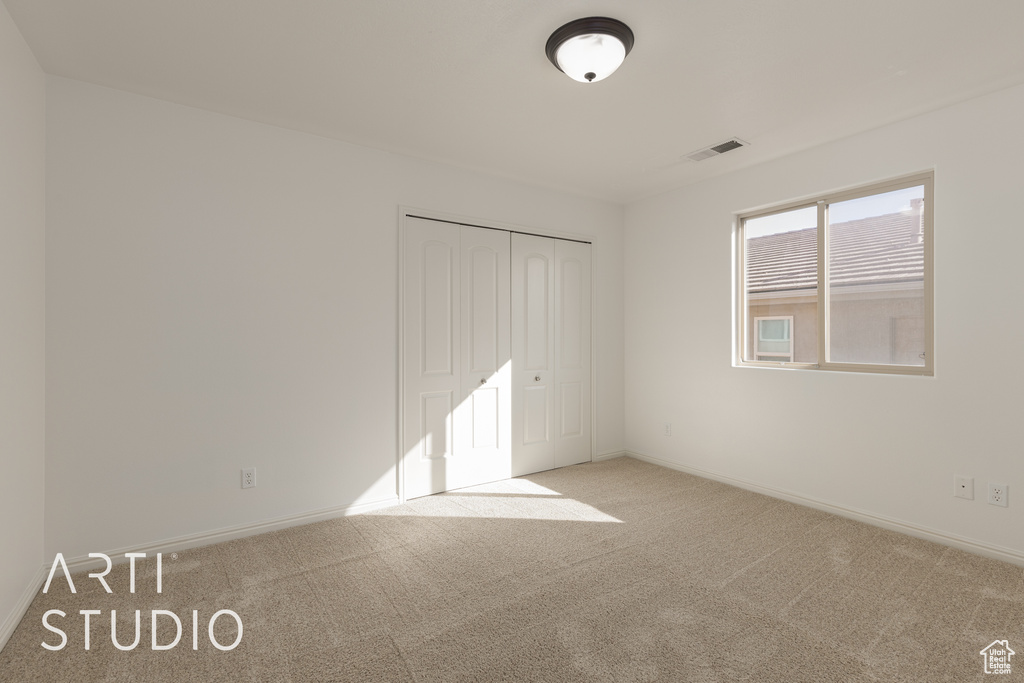 View of carpeted spare room