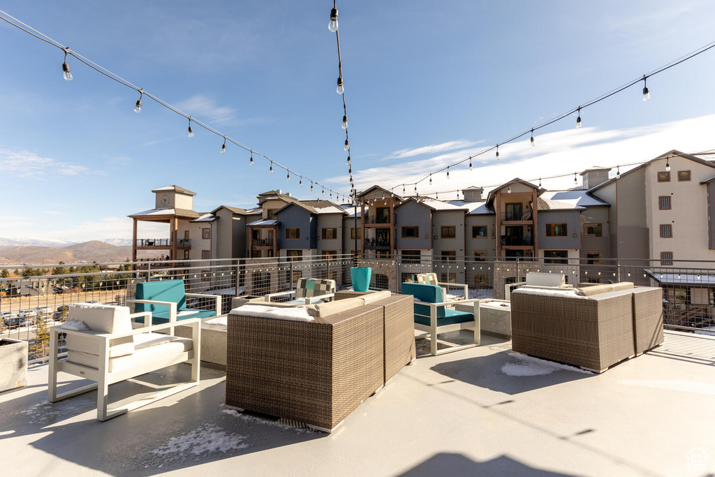 View of patio with a mountain view and outdoor lounge area