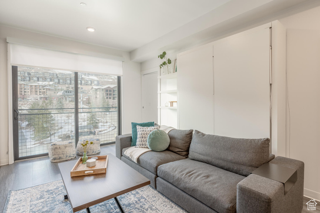 Living room with wood-type flooring