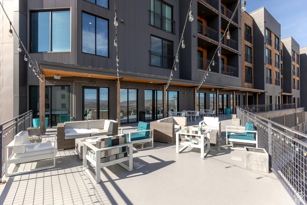 View of patio / terrace featuring a balcony and an outdoor living space