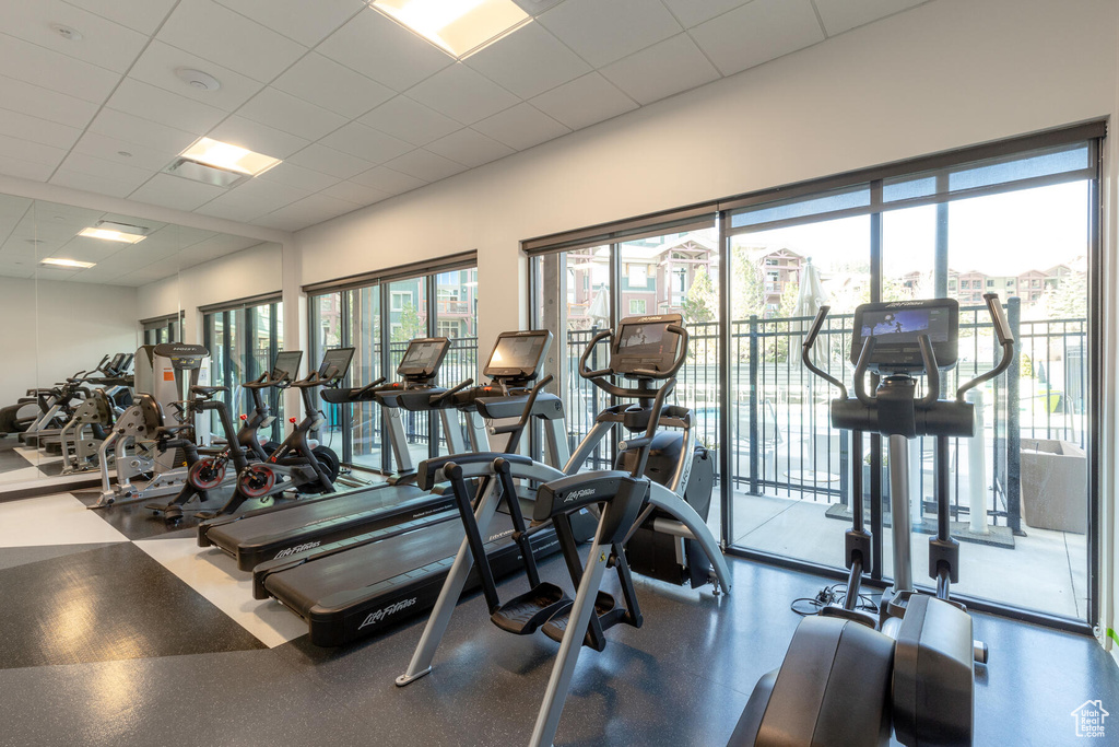 Workout area featuring a drop ceiling