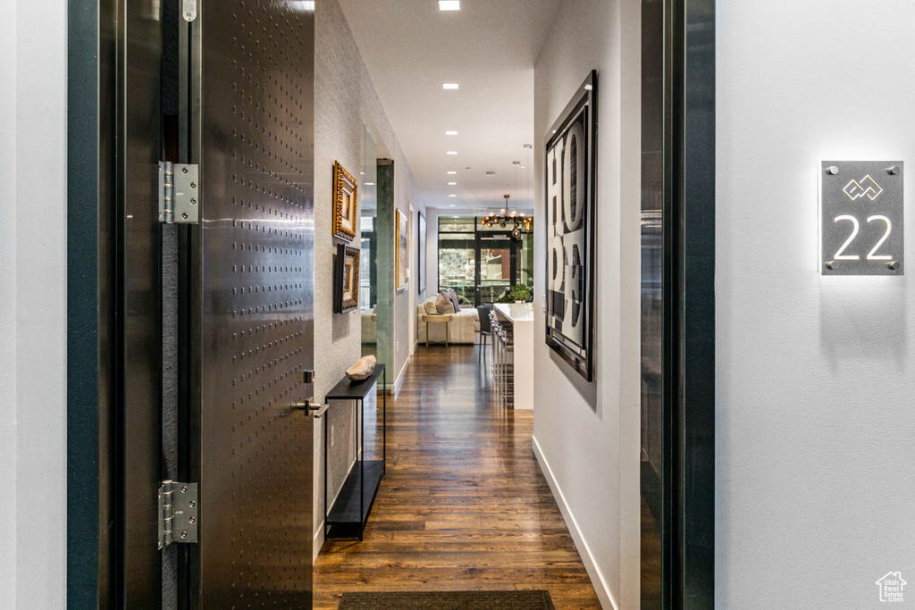 Corridor featuring dark hardwood / wood-style flooring