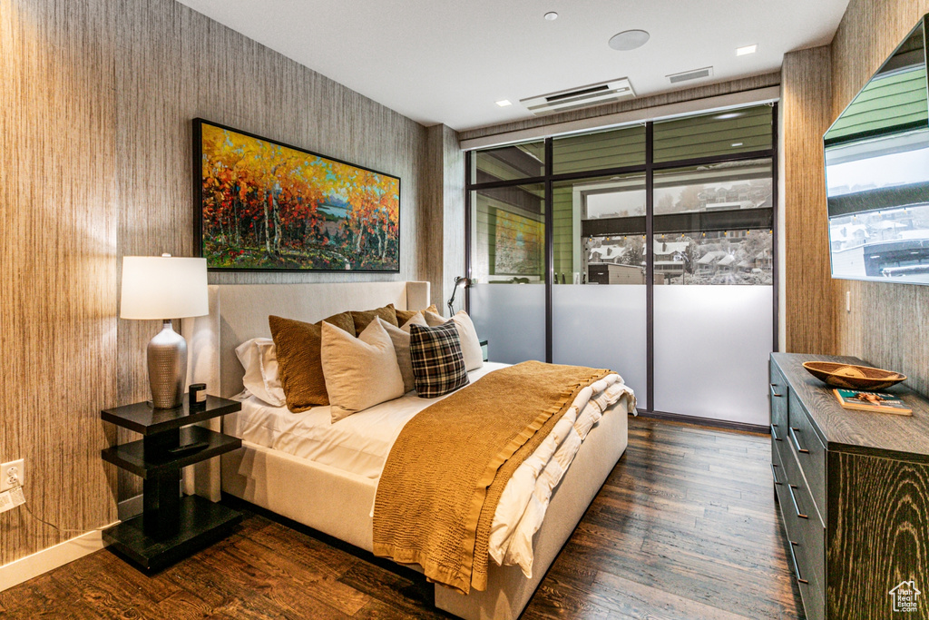 Bedroom featuring dark wood-type flooring