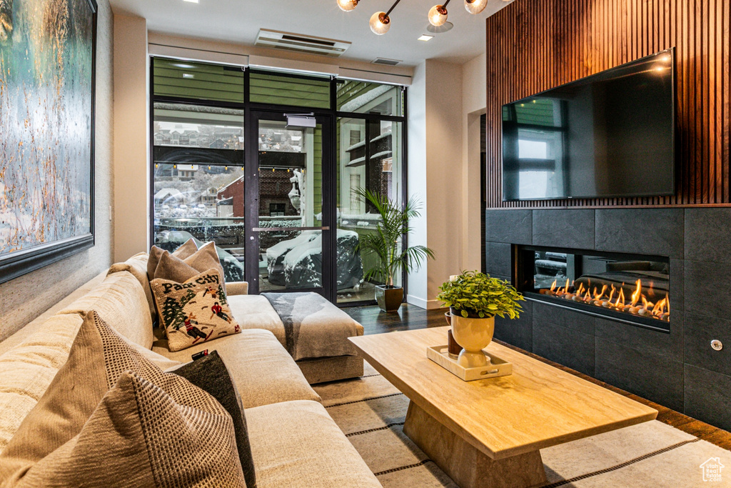 Living room featuring light hardwood / wood-style flooring and a tiled fireplace